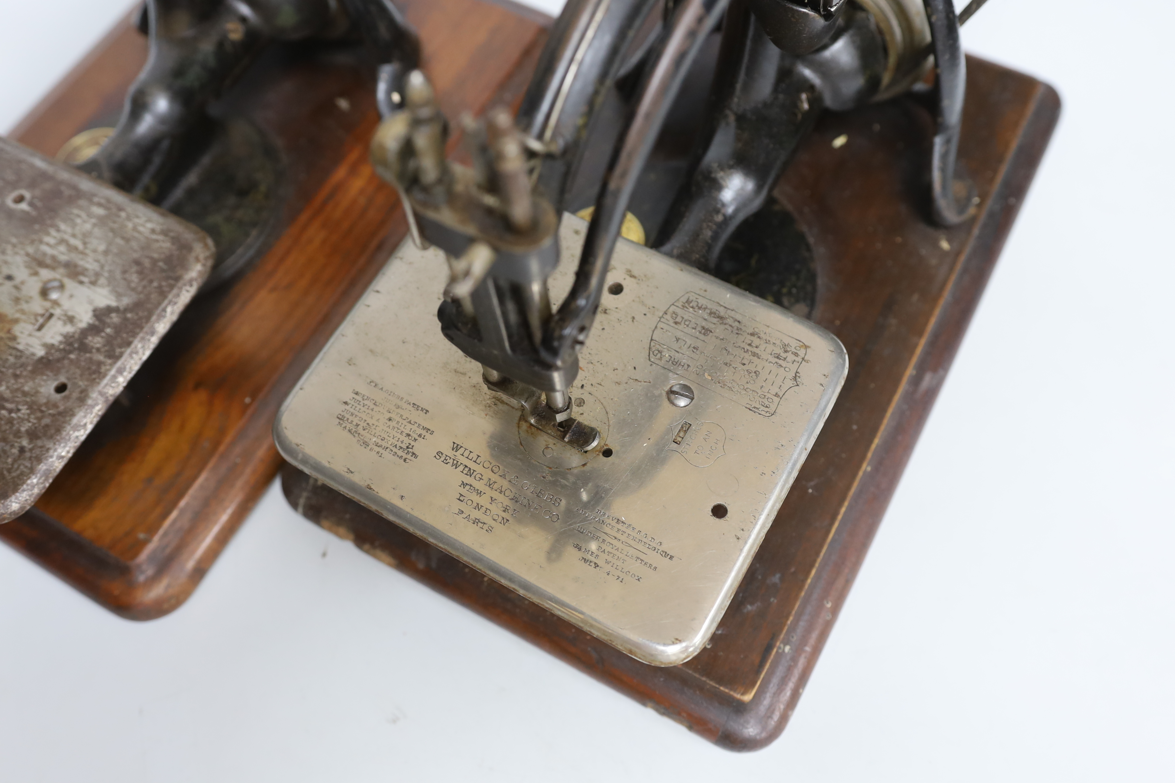 Two Willcox and Gibbs patent sewing machines, each 34cm wide